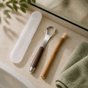 MSWK Tongue Cleaner, full-length travel case and Miswak on a bathroom ledge